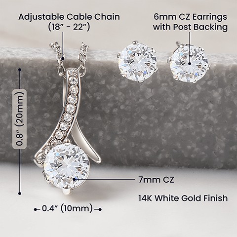 14k white gold finish 7mm cubic zirconia crystal 0.8" (20mm) / 0.4" (10mm) Adjustable cable chain: 18" - 22" (46 - 56 cm) Lobster clasp Earring Specifications  14k white gold finish 6mm round cut cubic zirconia crystals Post style backing