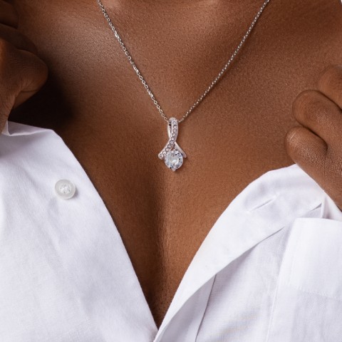 Imagine her reaction when she opens this stunning gift! The Alluring Beauty necklace features a petite ribbon shaped pendant that is sure to dazzle your special someone. Whether it's a birthday or anniversary, make sure to get her a gift she will love for years to come.