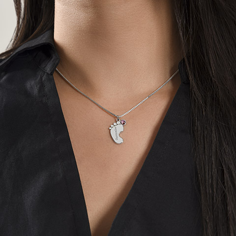 Celebrate the arrival of a newborn or cherish a precious memory with our Custom Baby Feet Necklace with Birthstone. Personalize your gift by engraving a name of your choice onto the pendant and choosing a crystal that correlates with the baby's birth month.