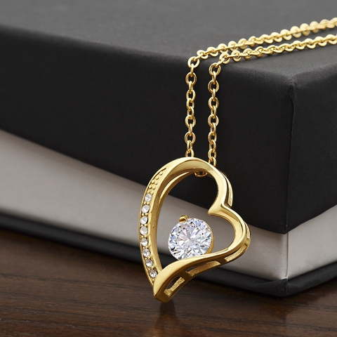 The dazzling Forever Love Necklace is sure to make her heart melt! This necklace features a stunning 6.5mm CZ crystal surrounded by a polished heart pendant embellished with smaller crystals to add extra sparkle and shine. Beautifully crafted with either a white gold or yellow gold finish, be sure to give her a classic gift she can enjoy everyday.
