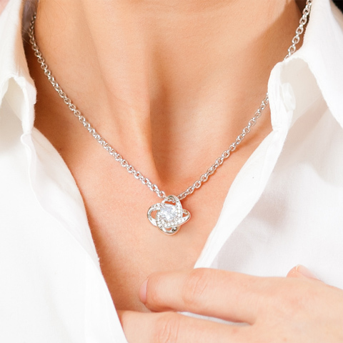 Imagine her reaction receiving this beautiful Love Knot Necklace. Representing an unbreakable bond between two souls, this piece features a beautiful pendant embellished with premium cubic zirconia crystals. Surprise your loved one with this gorgeous gift today!